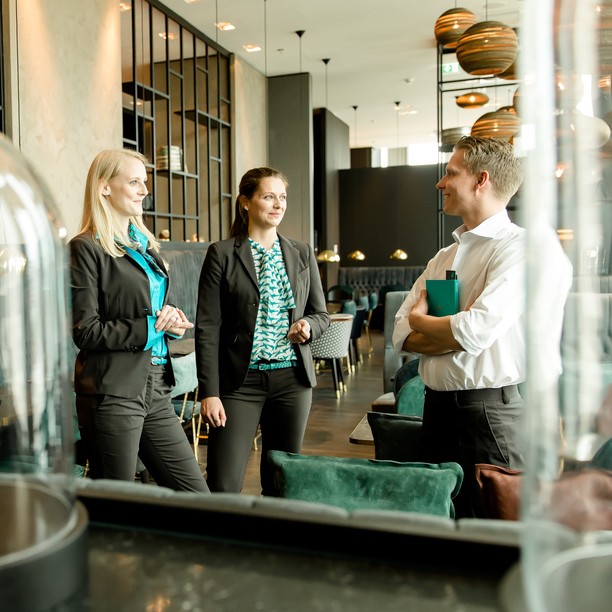 Sales Manager show the customer the Motel One Design